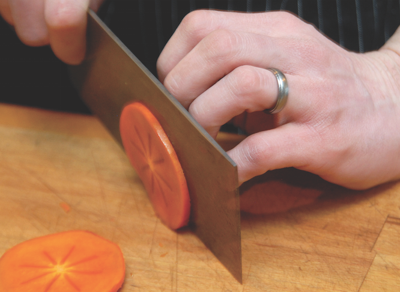 Slicing persimmons at Plate