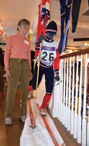 Olympian Trina Hosmer of Stowe stands by the racing outfit and gear she used in Sapporo, Japan, in 1972.
