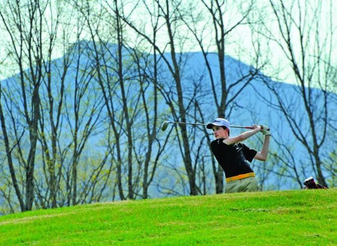 Harwood golfer Jarek Hammerl tees off during a home match Monday at the Country Club of Vermont.