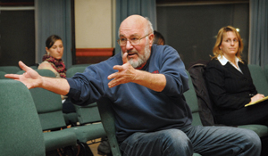 Ken Schumann gestures while discussing the importance of the music and art.