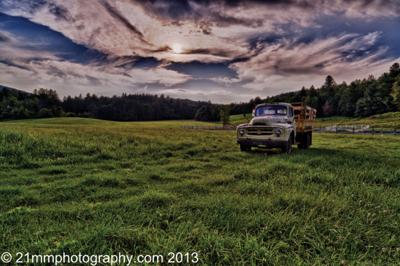 The exhibit features stunning landscape photographs printed on sheets of aluminum.