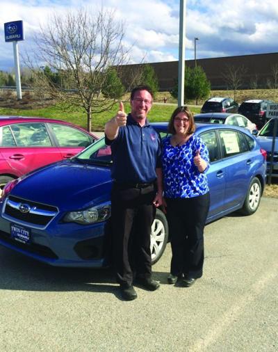 Jim Glassford of Twin City Subaru and Brynn Evans, executive director of Meals on Wheels of Lamoille County, are pictured next to a new Subaru Impreza that is being used for meal deliveries to vulnerable seniors in the farthest reaches of Lamoille County.