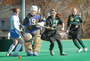 Goaltender Kim Haab kicks a shot away from the Raiders’ net
