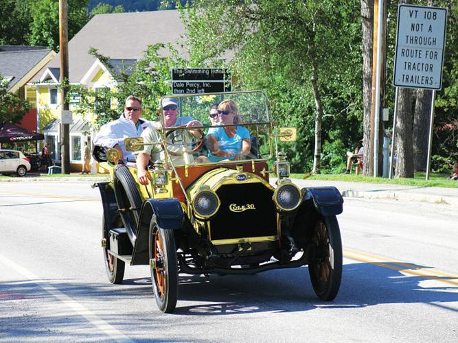 A vintage vehicle makes its way down Main Street in Stowe village during the 56th annual Antique & Classic Car Meet parade on Saturday afternoon.