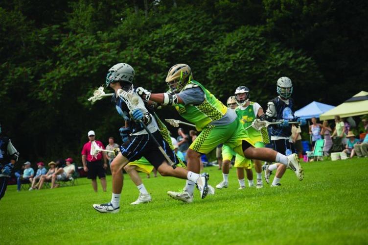 Teams clash in one of the Stowe Lax Festival tournament games that drew several hundred lacrosse players to the community.