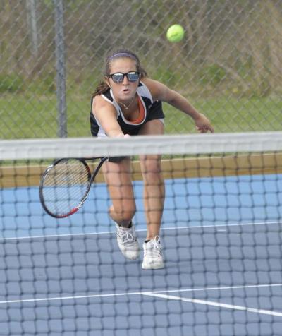 Harwood tennis player Shelby Parette reaches out to make a return Monday during the girls’ team’s 5-2 win over U-32.