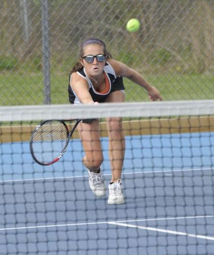 Harwood tennis player Shelby Parette reaches out to make a return Monday during the girls’ team’s 5-2 win over U-32.