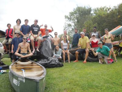 Johnson State College students and community members helped clean trash and debris from the Lamoille River.