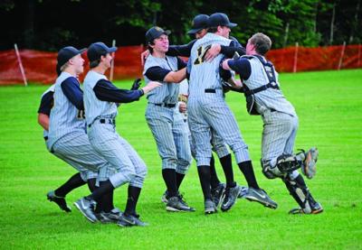 The Harwood Union High School baseball team celebrates Monday’s win in the Division II semifinal game.