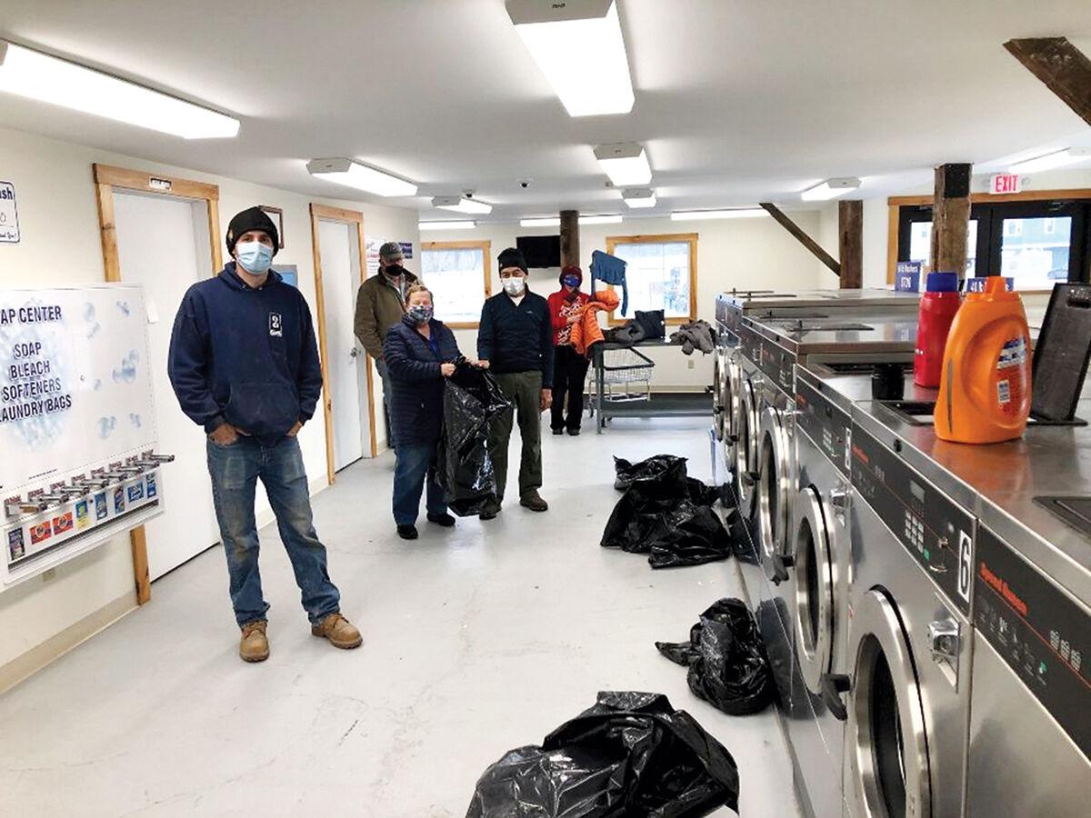CSH Rotary Club members clean donated winter clothes