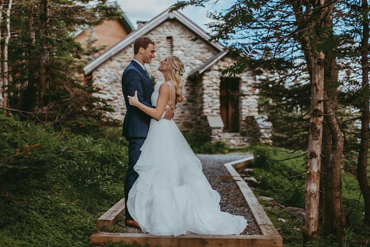 Couple hikes up Vermont mountain in wedding dresses to wed at