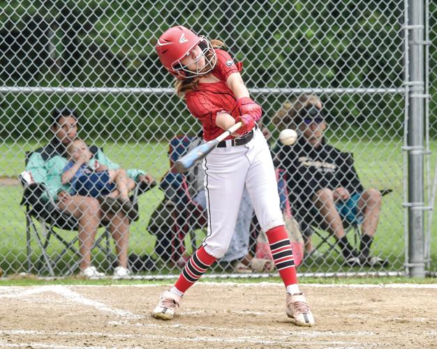 Jamie Nassar reaches for an outside pitch