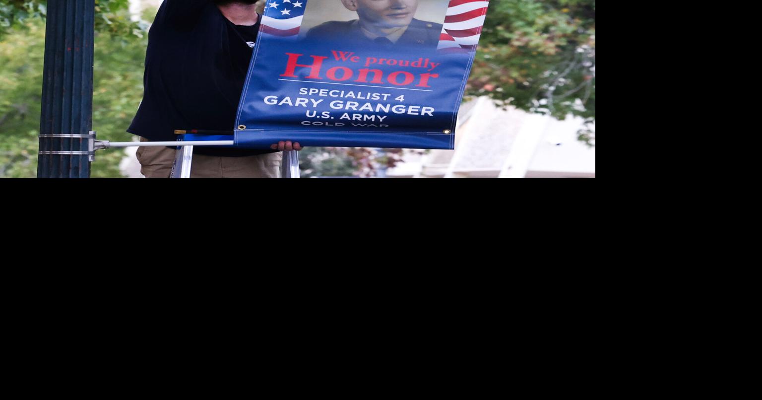 Hometown Heroes banners hung preparing for Veterans Day