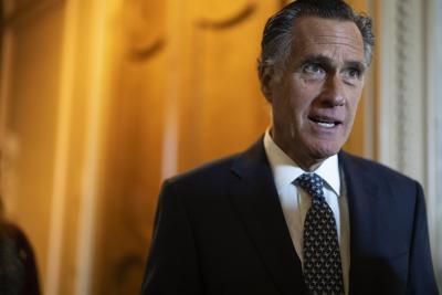 Mitt Romney speaks to reporters outside of the Senate Chambers during a series of votes in the U.S. Capitol Building on May 11, 2022, in Washington, DC.