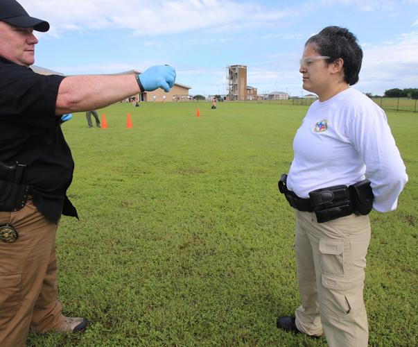 Recruits undergo pepperspray training in police academy