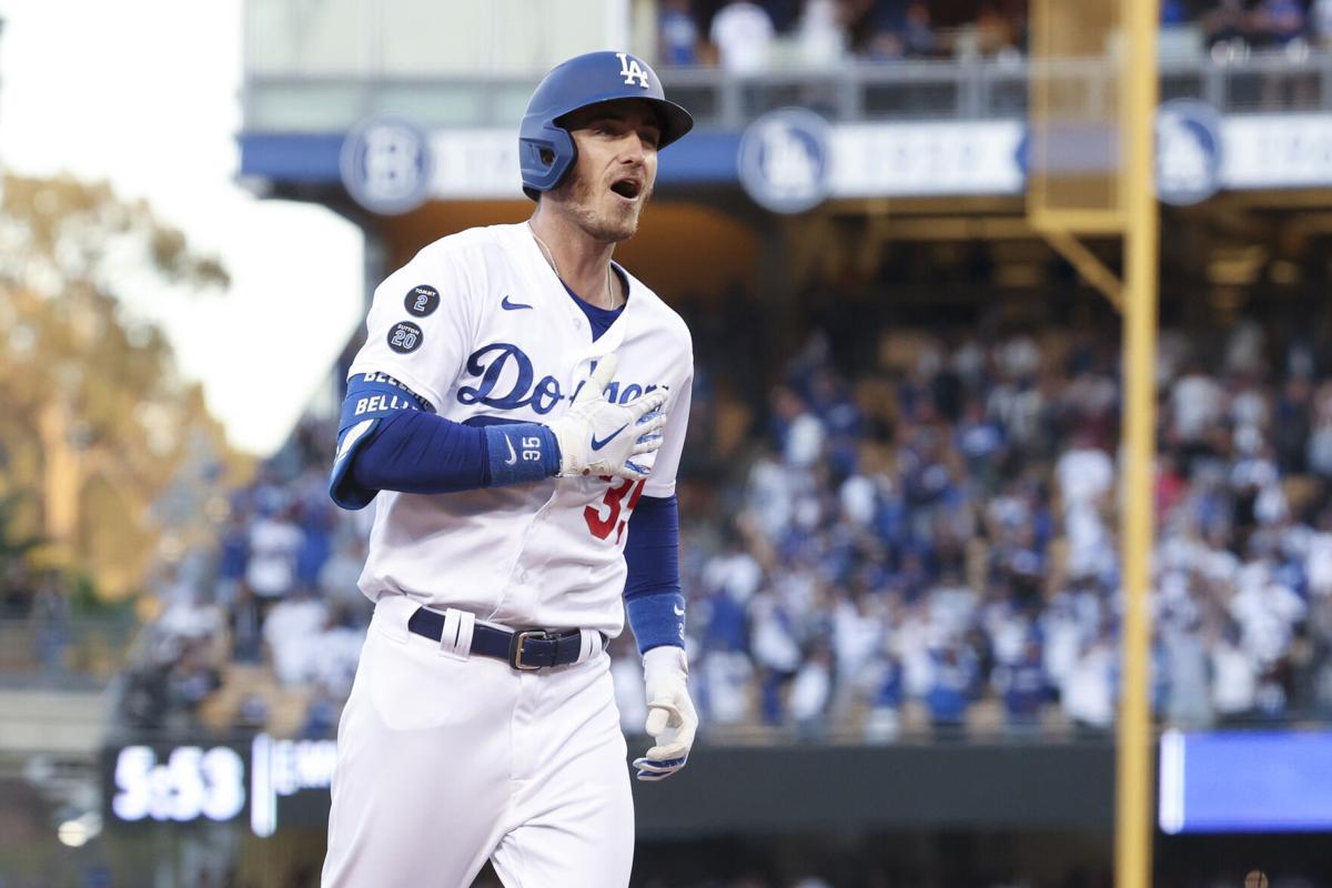 The Los Angeles Dodgers' Cody Bellinger celebrates after a three-run home run to tie the game during the eighth inning against the Atlanta Braves in Game 3 of the National League Championship Series at Dodger Stadium on Tuesday, Oct. 19, 2021, in Los Angeles.