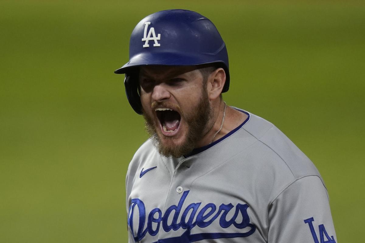 Los Angeles Dodgers' Mookie Betts scores on a fielders choice by Max Muncy  during the fifth inning in Game 1 of the baseball World Series against the  Tampa Bay Rays Tuesday, Oct.