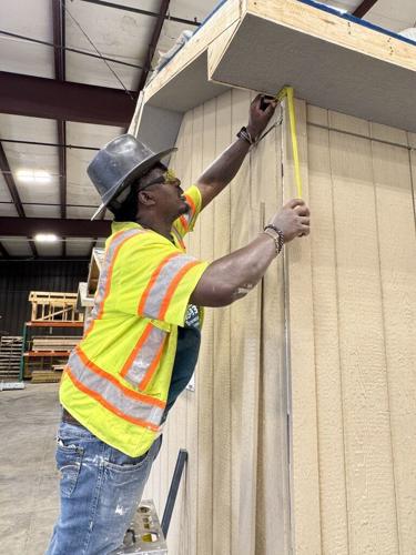 Father attends Building Construction program with son