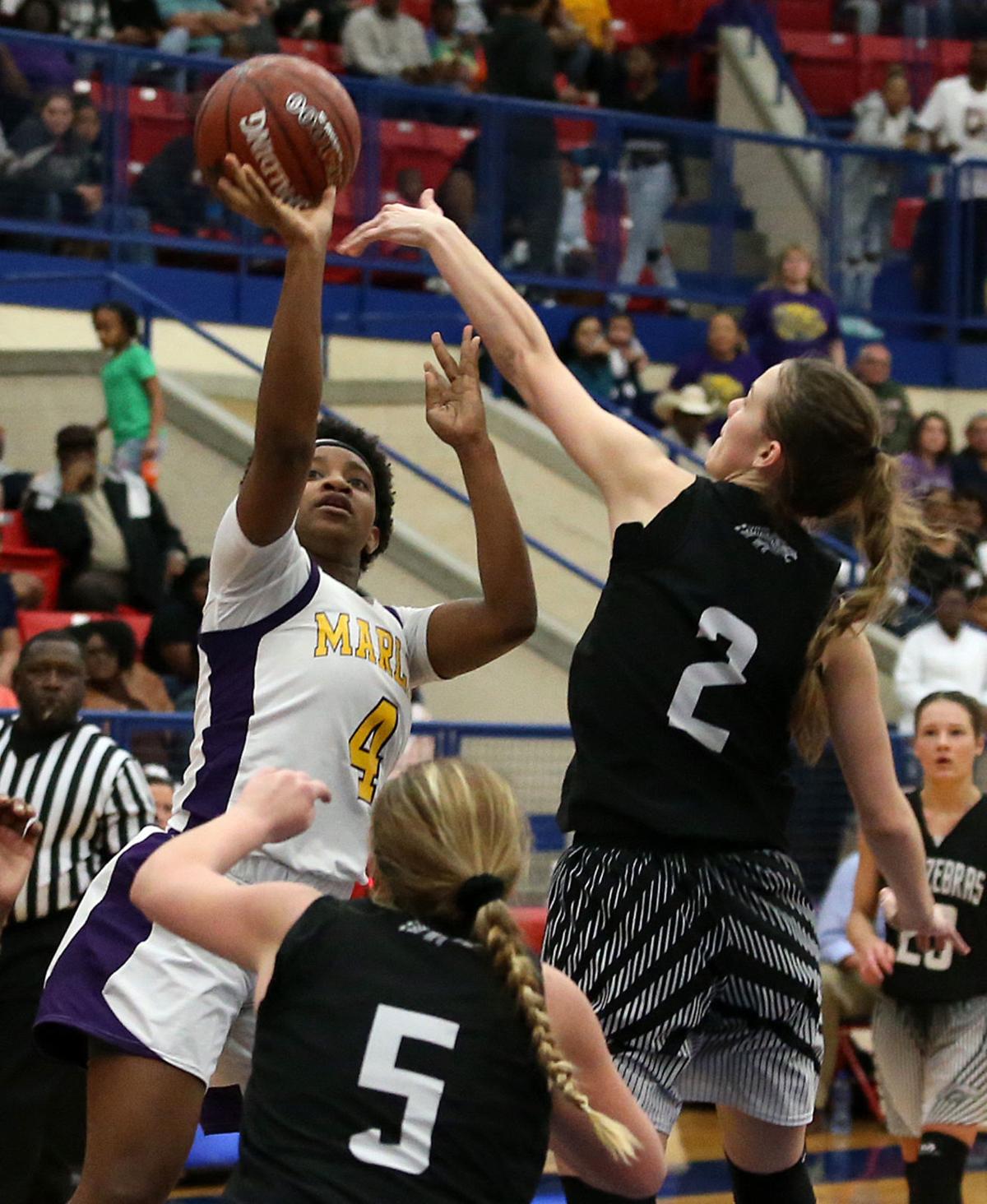 No mistaking Mystique Womack nets 37 points as Marlin reaches first
