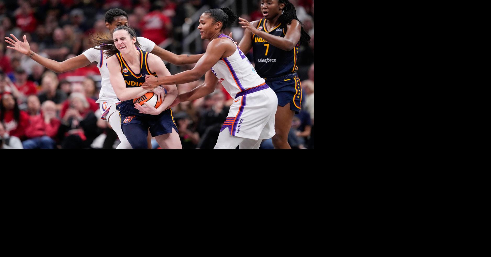 Phoenix Mercury forward Alyssa Thomas (25) attempts to strip the ball from Indiana Fever guard Caitlin Clark (22) on Monday,