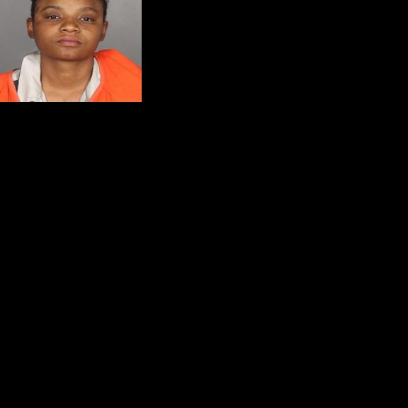 Woman accused of biting officer after arrest