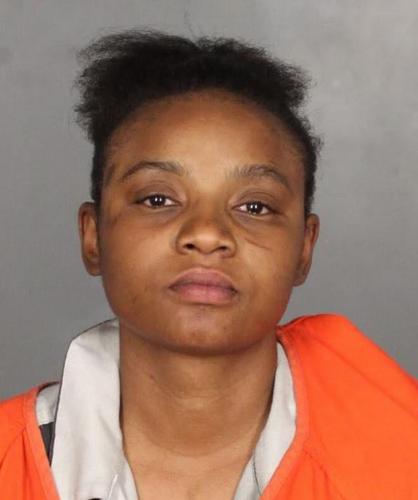Woman accused of biting officer after arrest