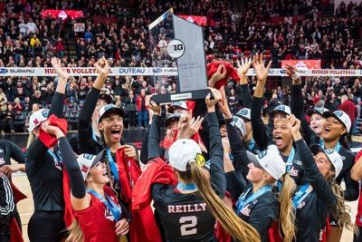 Nov 28, 2025; Lincoln, Neb, USA; Nebraska Cornhuskers setter Bergen Reilly (2) hoists the 2025 Big Ten Volleyball Champions trophy to her teammates after the match against the Penn State Nittany Lions at Bob Devaney Sports Center. Mandatory Credit: Dyla...