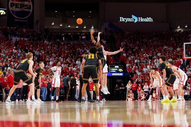 Mar 8, 2026; Lincoln, Nebraska, USA; Iowa Hawkeyes forward Cam Manyawu (3) and Nebraska Cornhuskers forward Rienk Mast (51) tip off to start the game at Pinnacle Bank Arena. Mandatory Credit: Dylan Widger-Imagn Images