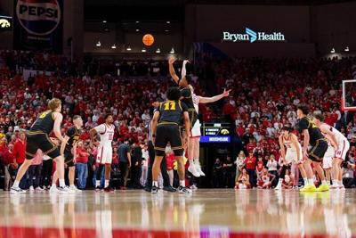 Mar 8, 2026; Lincoln, Nebraska, USA; Iowa Hawkeyes forward Cam Manyawu (3) and Nebraska Cornhuskers forward Rienk Mast (51) tip off to start the game at Pinnacle Bank Arena. Mandatory Credit: Dylan Widger-Imagn Images