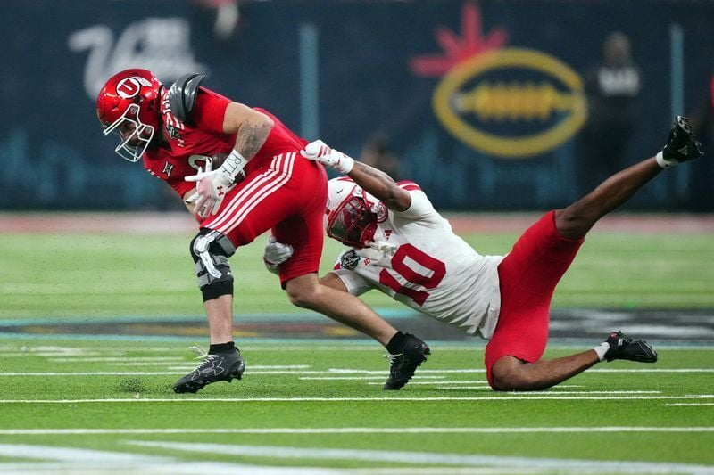Dec 31, 2025; Las Vegas, NV, USA; Utah Utes wide receiver Ryan Davis (9) carries the ball against Nebraska Cornhuskers defensive back Andrew Marshall (10) in the second half during the SRS Distribution Las Vegas Bowl at Allegiant Stadium. Mandatory Cred...