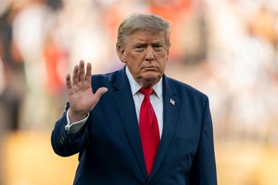 President Donald Trump waves to the crowd following Spain’s victory of Argentina during the FIFA World Cup 2026 final between
