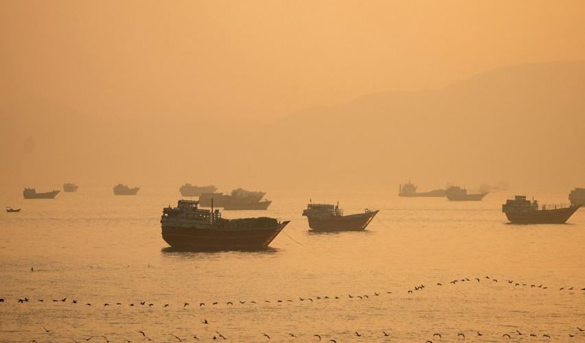 FILE PHOTO: Vessels at the Strait of Hormuz, as seen from Musandam