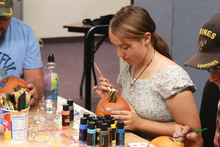 Veterans join Club Whatever members for pumpkin-painting activity