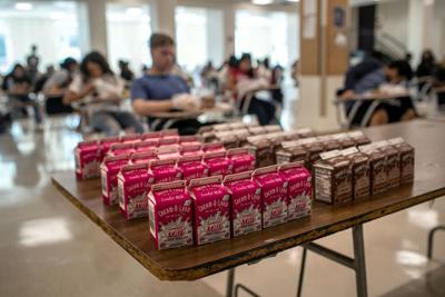 Students sit for lunch in the cafeteria during the first day of school at Stamford High School on Sept. 08, 2020, in Stamford, Connecticut. Due to the coronavirus pandemic, many school districts nationwide delayed the first day of school until after the...