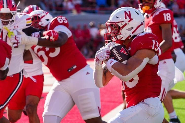 Oct 3, 2026; Lincoln, Nebraska, USA;  Nebraska Cornhuskers running back Mekhi Nelson (13) runs for a touchdown against the Maryland Terrapins during the second quarter at Memorial Stadium.  Mandatory Credit: Dylan Widger-Imagn Images