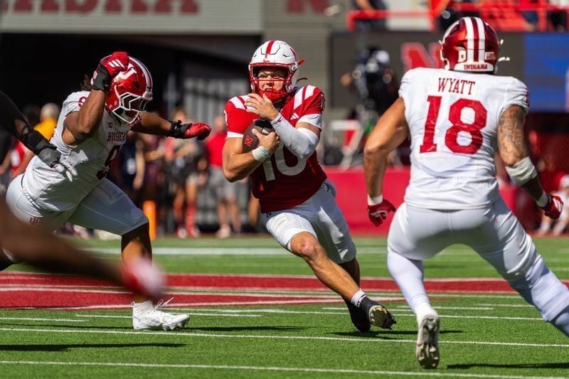 Oct 10, 2026; Lincoln, Nebraska, USA;  Nebraska Cornhuskers quarterback Anthony Colandrea (10) runs against Indiana Hoosiers defensive lineman Stephen Daley (9) and defensive lineman Kellan Wyatt (18) during the third quarterat Memorial Stadium.  Mandat...