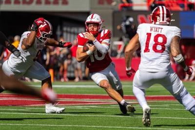 Oct 10, 2026; Lincoln, Nebraska, USA;  Nebraska Cornhuskers quarterback Anthony Colandrea (10) runs against Indiana Hoosiers defensive lineman Stephen Daley (9) and defensive lineman Kellan Wyatt (18) during the third quarterat Memorial Stadium.  Mandat...