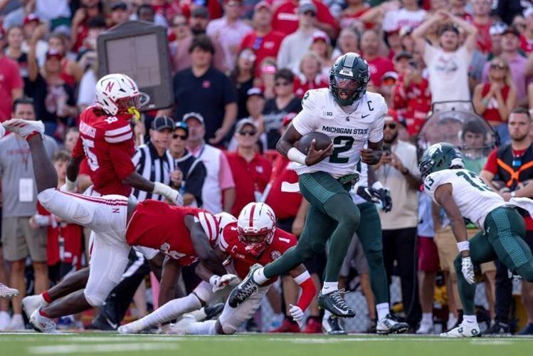 Oct 4, 2025; Lincoln, Nebraska, USA; Michigan State Spartans quarterback Aidan Chiles (2) rushes for a touchdown during the game against Nebraska at Memorial Stadium. Mandatory Credit: Kylie Graham-Imagn Images