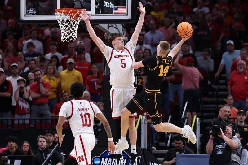 Mar 26, 2026; Houston, TX, USA; Nebraska Cornhuskers forward Braden Frager (5) attempts to block the shot of Iowa Hawkeyes guard Bennett Stirtz (14) in the second half during a Sweet Sixteen game of the South Regional of the men's 2026 NCAA Tournament a...
