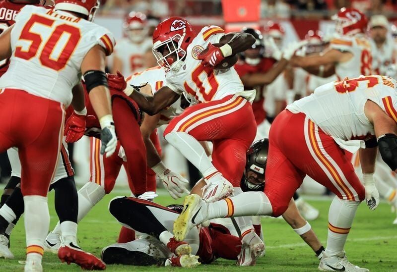 Aug 22, 2026; Tampa, Florida, USA;  Kansas City Chiefs running back Emmett Johnson (10) runs against the Tampa Bay Buccaneers during the first half at Raymond James Stadium.  Mandatory Credit: Kim Klement Neitzel-Imagn Images
