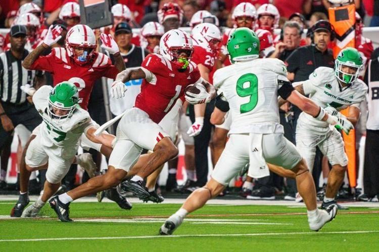 Sep 19, 2026; Lincoln, Nebraska, USA;  Nebraska Cornhuskers wide receiver Nyziah Hunter (1) runs against North Dakota Fighting Hawks safety Tyler Erkman (9) during the fourth quarter at Memorial Stadium.  Mandatory Credit: Dylan Widger-Imagn Images