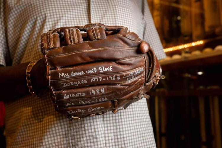Dusty Baker wears the baseball glove he used during his playing career with the Los Angeles Dodgers, San Francisco Giants and Oakland Athletics at his home in Granite Bay on Wednesday, June 3, 2026.