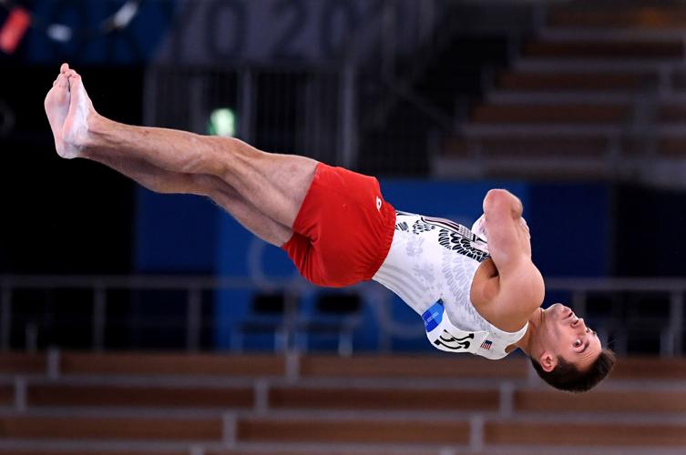 The United States' Samuel Mikulak competes in the floor exercise during Men's Team Gymnastics qualifying at the 2020 Tokyo Olympics on Saturday, July 24, 2021, in Tokyo.