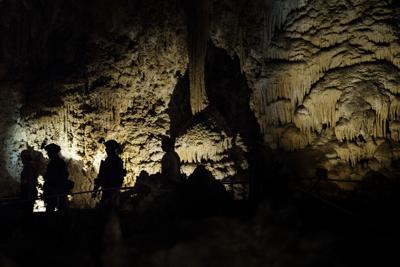 Members of a Secret Service counter-assault team walk ahead of President Barack Obama and the first family as they tour Carlsbad Caverns National Park on June 17, 2016, in Carlsbad, New Mexico.