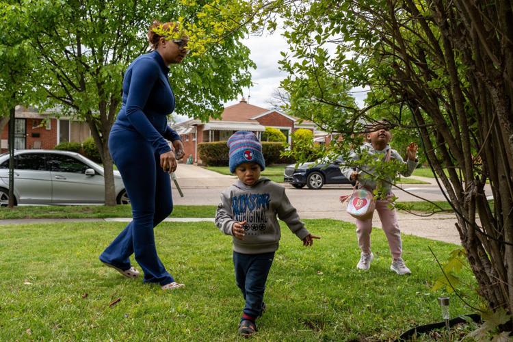 Desarae Embry, 24, left, watches her children, DJ Embry, 2, middle, and Dai’Lani Embry, 4, play outside their home in Detroit on Wednesday, May 6, 2026. Desarae said Rx Kids payments have helped her family afford essentials for their children.