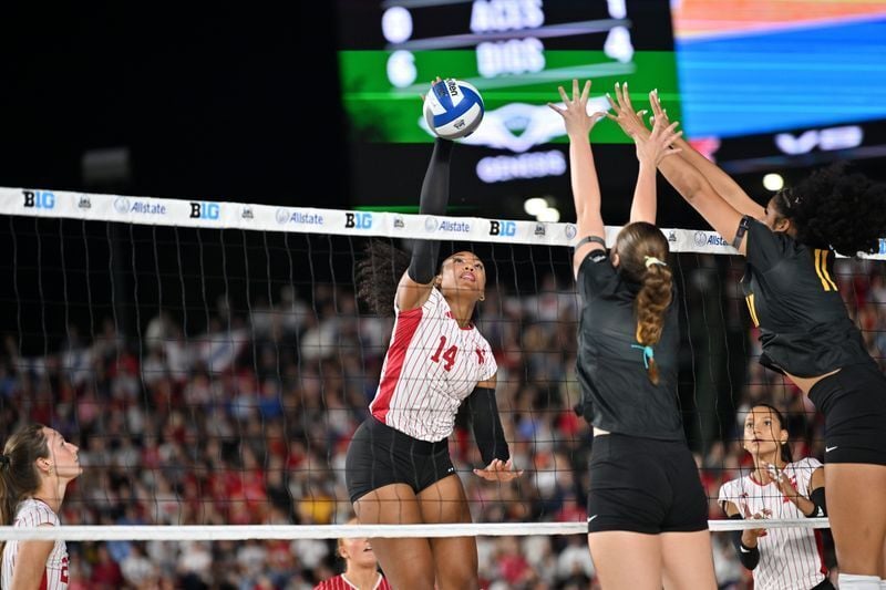 Sep 6, 2026; Chicago, IL, USA;  Nebraska Cornhuskers middle blocker Manaia Ogbechie (14) spikes the ball against the Missouri Tigers during the first set at Wrigley Field.  Mandatory Credit: Patrick Gorski-Imagn Images