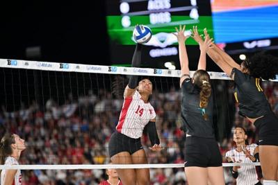 Sep 6, 2026; Chicago, IL, USA;  Nebraska Cornhuskers middle blocker Manaia Ogbechie (14) spikes the ball against the Missouri Tigers during the first set at Wrigley Field.  Mandatory Credit: Patrick Gorski-Imagn Images