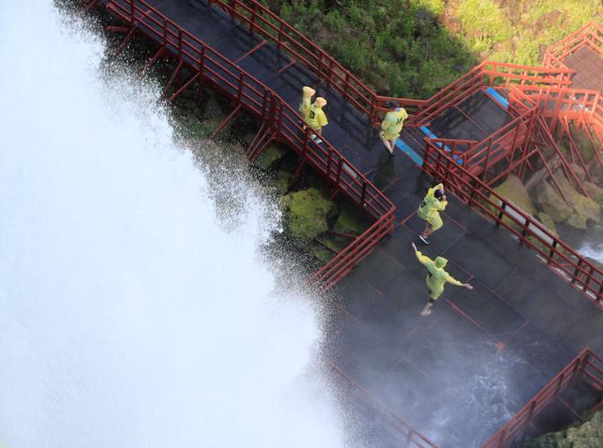 A view of Niagara Falls from the air, by boat and on foot
