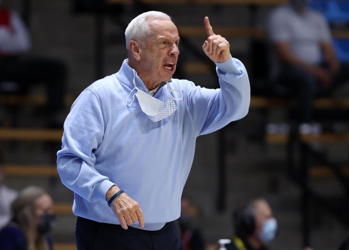 In this photo from March 19, 2021, head coach Roy Williams of the North Carolina Tar Heels reacts on the sidelines during the first half against the Wisconsin Badgers in the first-round game of the 2021 NCAA Men's Basketball Tournament at Mackey Arena i...