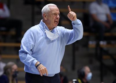 In this photo from March 19, 2021, head coach Roy Williams of the North Carolina Tar Heels reacts on the sidelines during the first half against the Wisconsin Badgers in the first-round game of the 2021 NCAA Men's Basketball Tournament at Mackey Arena i...